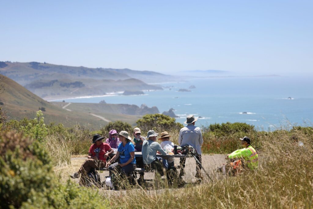 Camino de Sonoma hikers rest just north of Russian Gulch State Beach near Jenner Tuesday, May 19, 2026. (Beth Schlanker / The Press Democrat)