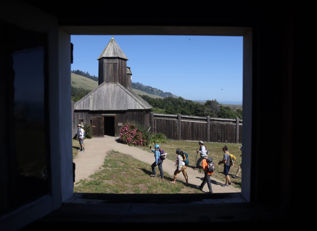 The arrival at the chapel at Fort Ross is an emotional moment for many, marking the end of the 85-mile, six-day Camino de Sonoma. Photo taken in Fort Ross Tuesday, May 19, 2026. (Beth Schlanker / The Press Democrat)