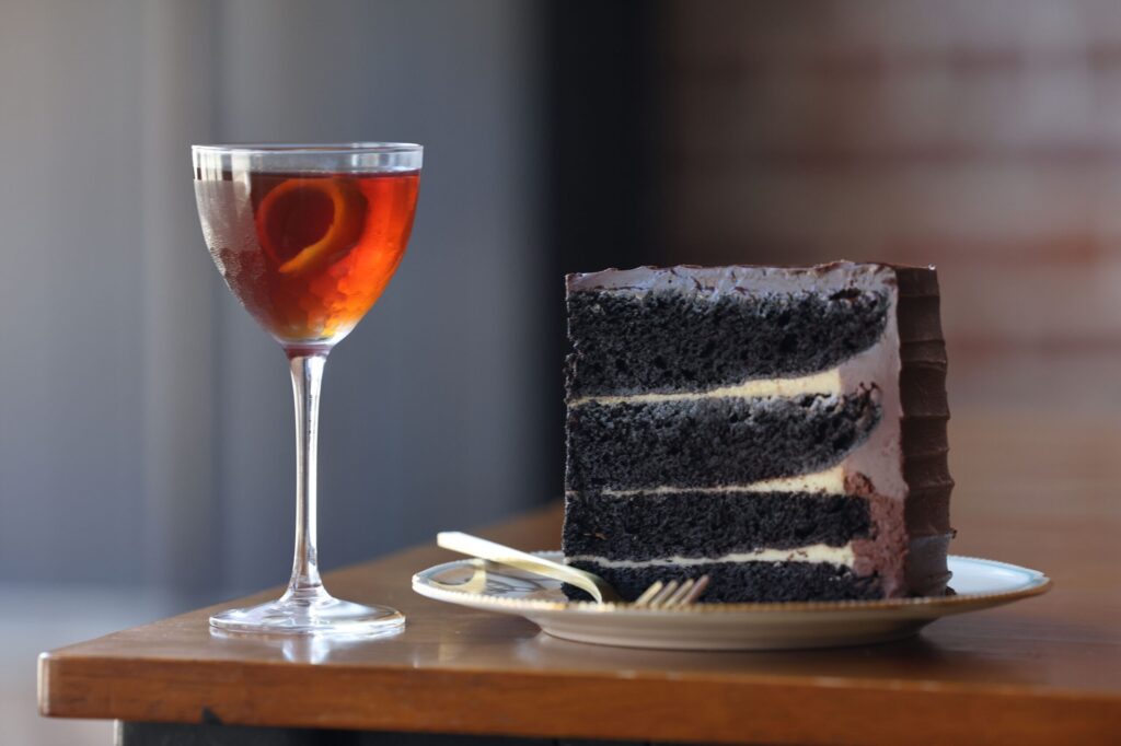 Spiced chocolate passion fruit cake and the Gunsmith cocktail at Taste Petaluma in Petaluma Tuesday, Aug. 11, 2026. (Beth Schlanker / The Press Democrat)