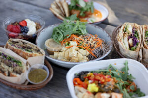 A variety of bowls and sandwiches, including a soba noodle bowl with tofu, arugula, carrots, peanuts, edamame and a red curry peanut dressing at Wylde Provisions Co. in Sebastopol Sunday, Aug. 23, 2026. (Beth Schlanker / The Press Democrat)
