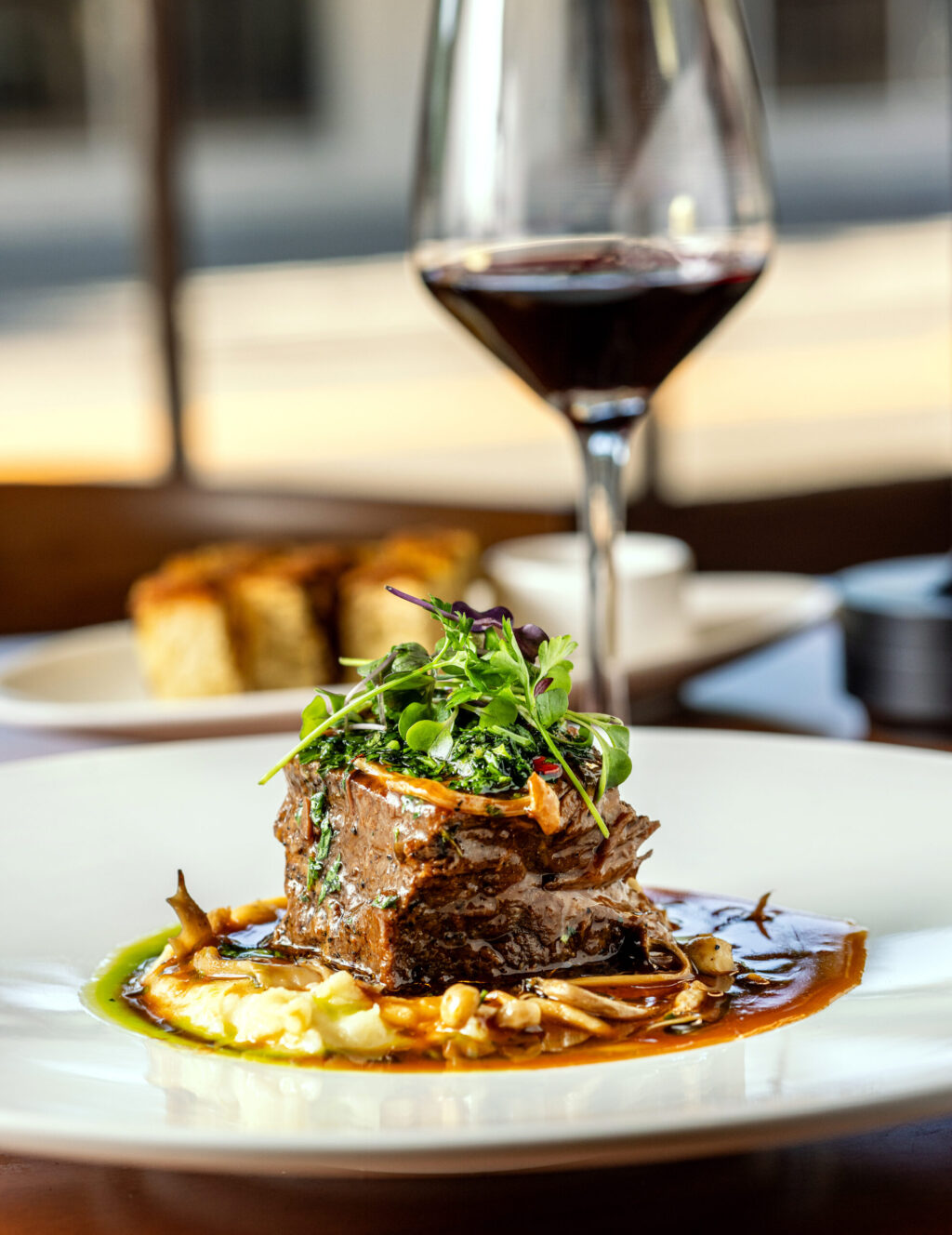 Red Wine-Braised Short Ribs with carrots, mushrooms, olive oil mashed potatoes, gremolata and basil oil from Capriciano Osteria Thursday, July 30, 2026 in Santa Rosa. (John Burgess/The Press Democrat)