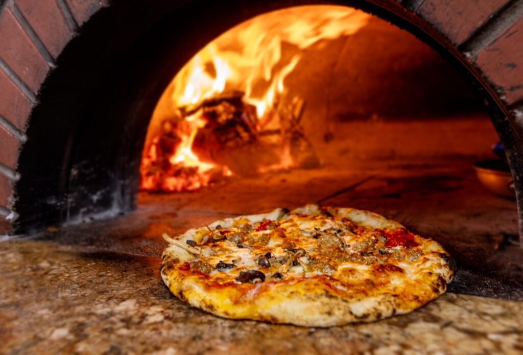 Funghi and Salsicce Pizza with wild mushrooms, Italian sausage and fontina fired in the wood burning at Capriciano Osteria Thursday, July 30, 2026 in Santa Rosa. (John Burgess/The Press Democrat)