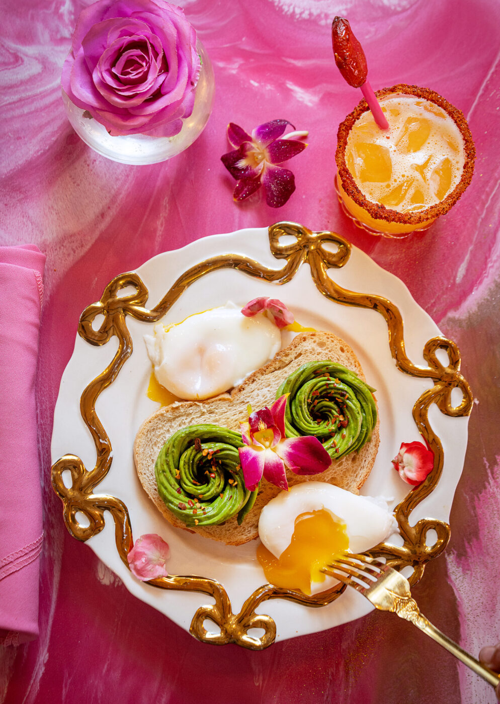 Avocado Toast with Poached Eggs and a Mexican Lollipop Margarita from Café Carrusel Tuesday, July 28, 2026 in Santa Rosa. (John Burgess/The Press Democrat)