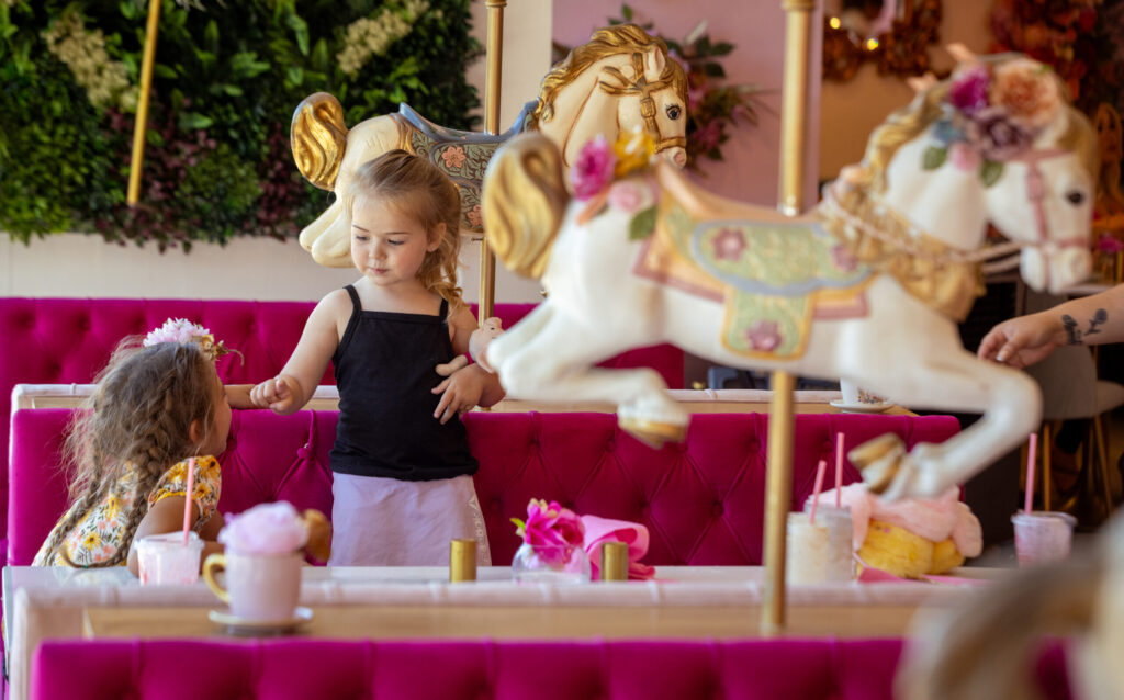 With horses between every booth and fun food presentations, Café Carrusel is a pink wonderland for young girls like Ellie, 7, left, and Angie Hanchey, 3, of Healdsburg, Tuesday, July 28, 2026 in Santa Rosa. (John Burgess/The Press Democrat)
