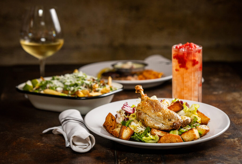 Crispy Duck Confit with bitter greens croutons, duck fat potato and brown butter vinaigrette from Lo & Behold Monday, Aug. 3, 2026 in Healdsburg. (John Burgess/The Press Democrat)
