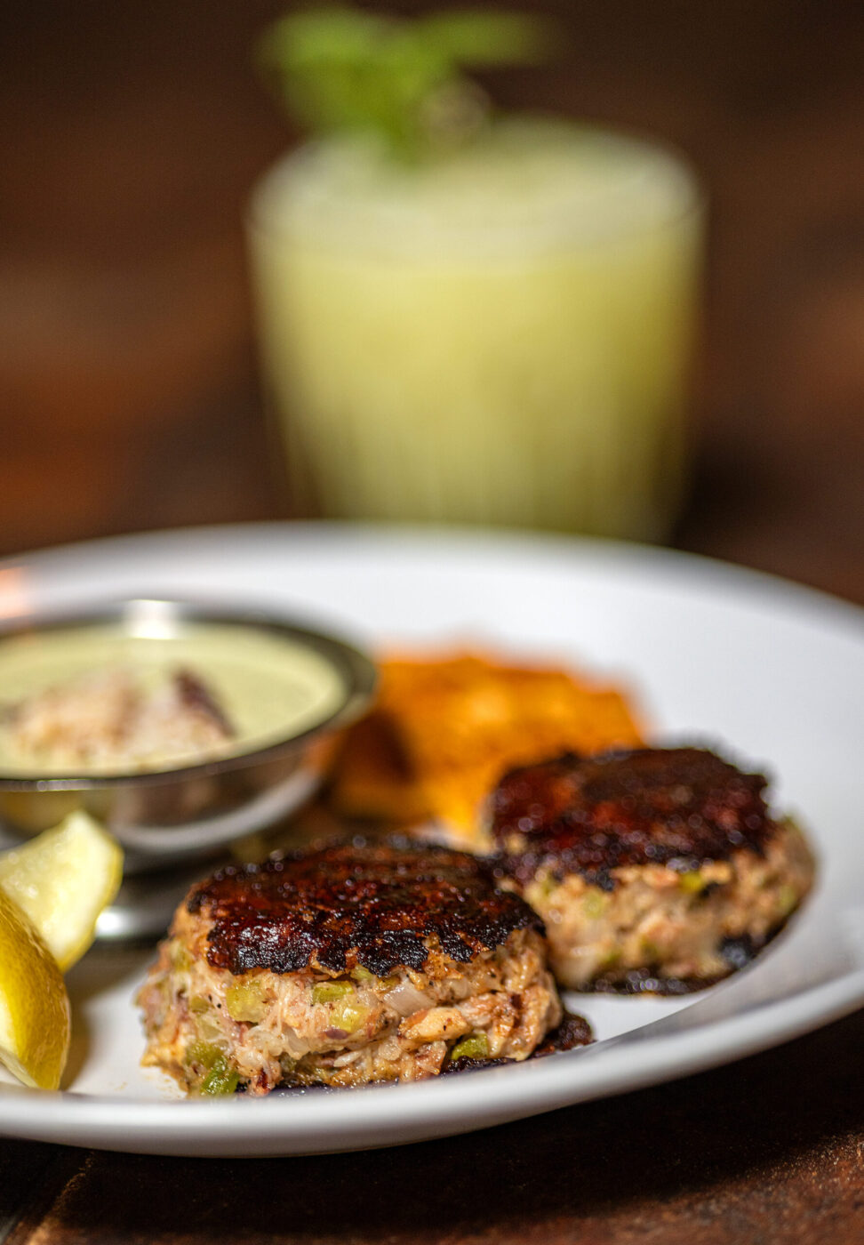 Grilled Crab Cakes with ham hock, reinvigorating sauce, and soda crackers from Lo & Behold Monday, Aug. 3, 2026 in Healdsburg. (John Burgess/The Press Democrat)
