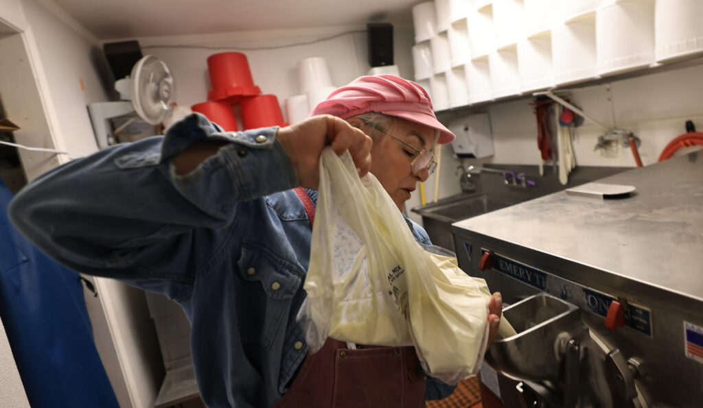 Screamin' Mimi’s Maraline “Mimi” Mazzetti Olson mixes up a batch of Cookie Break ice cream, Wednesday, August 12, 2026, in Sebastopol. (Kent Porter / The Press Democrat)