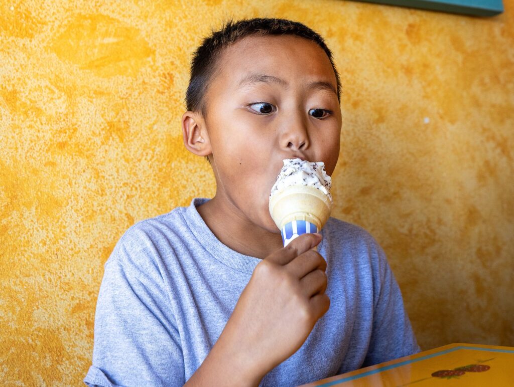 Joshua Bison, 9, digs into his Galaxy ice cream cone at Screamin’ Mimi’s Tuesday, Aug. 11, 2026 in Sebastopol. (John Burgess/The Press Democrat)
