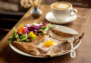 The Complete Buckwheat Crepes with ham, mild Emmentaler cheese and a sunny-side-up egg from Sarmentine Bakery Petaluma Thursday, May 7, 2026. (John Burgess/The Press Democrat)