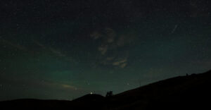 A Perseid meteor, right, dots the morning sky, Thursday, August 13, 2026. The Perseid’s are remnants of comet 109P/Swift-Tuttle and will active until August 24. Geyser Peak, above Alexander Valley, is in the distance with a hint of the northern lights. (Kent Porter / The Press Democrat)