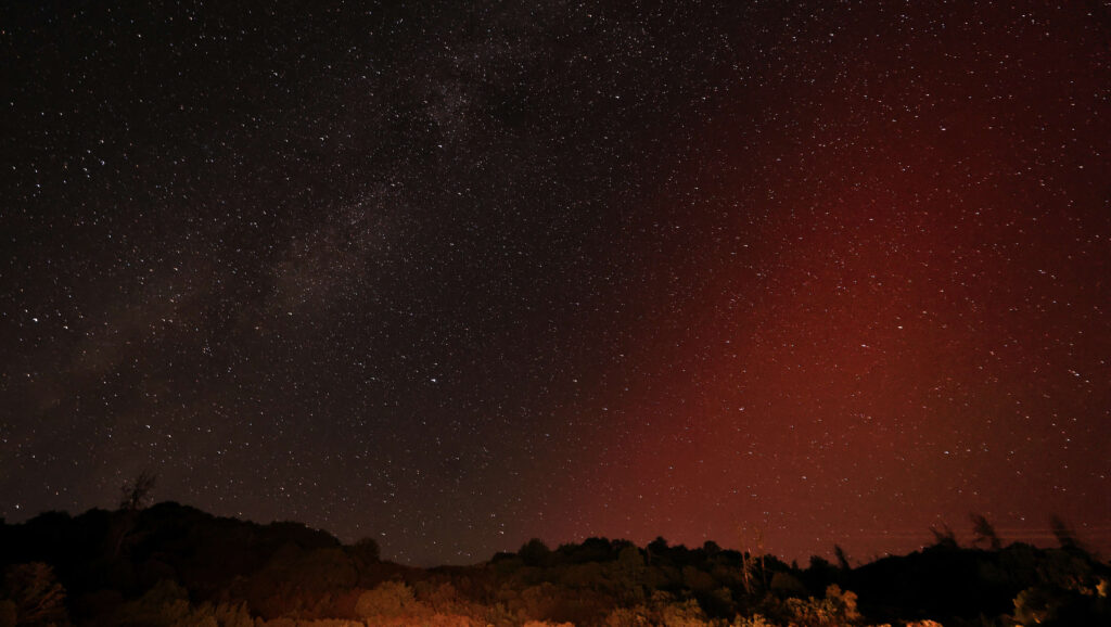 The aurora borealis moves in parallel to the Milky Way, photographed from the Hopland Grade, Monday, Oct. 7, 2024. For the third time this year, a geomagnetic storm has afforded Northern California residents a low latitude northern lights show. (Kent Porter / The Press Democrat)