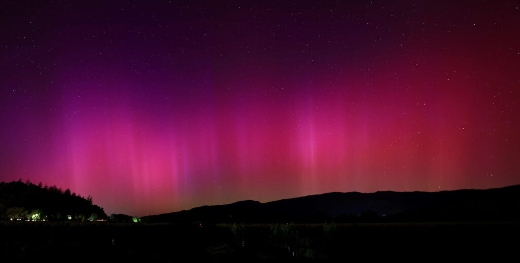In what could be called an epic, otherworldly showing for a large chunk of the Northern Hemisphere, the aurora borealis lights up the horizon over a vineyard near Hopland, late Friday, May 10, 2024. (Kent Porter / The Press Democrat) 2024
