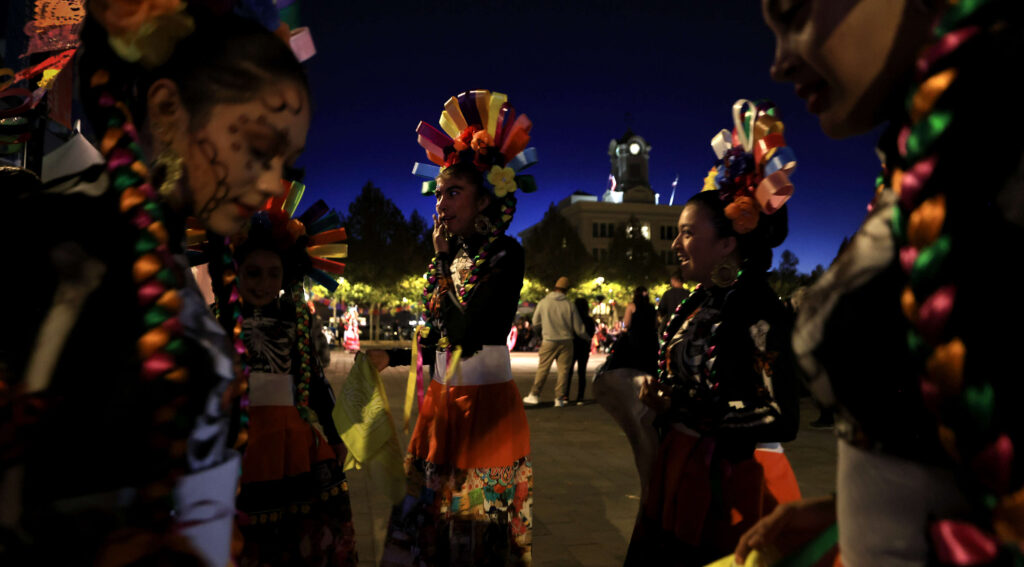 Ballet Folklorico Netzahualcoyotl prepare to perform at twilight during Santa Rosa's 24th Annual Dia de los Muertos celebration, Saturday, Nov. 2, 2024 at Old Courthouse Square. (Kent Porter / The Press Democrat)