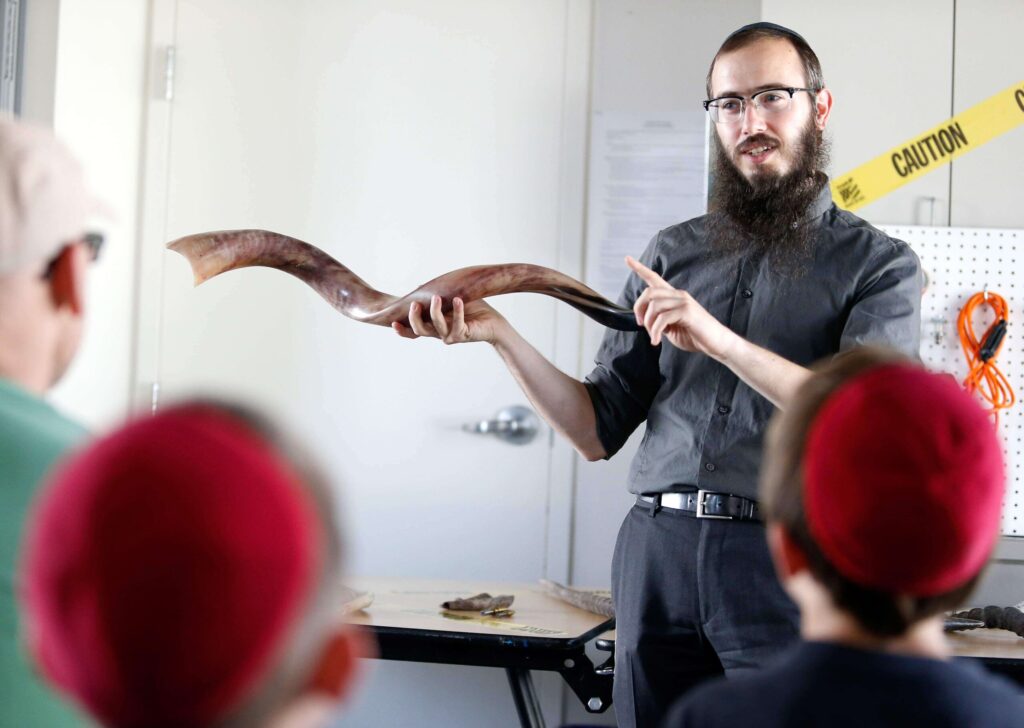 Rabbi Dovid Bush, of the Chabad Jewish Center of Petaluma, teaches a pre-Rosh Hashanah shofar making workshop at Petaluma Arts Center in Petaluma on Sunday, September 10, 2017. (Alvin Jornada / The Press Democrat)
