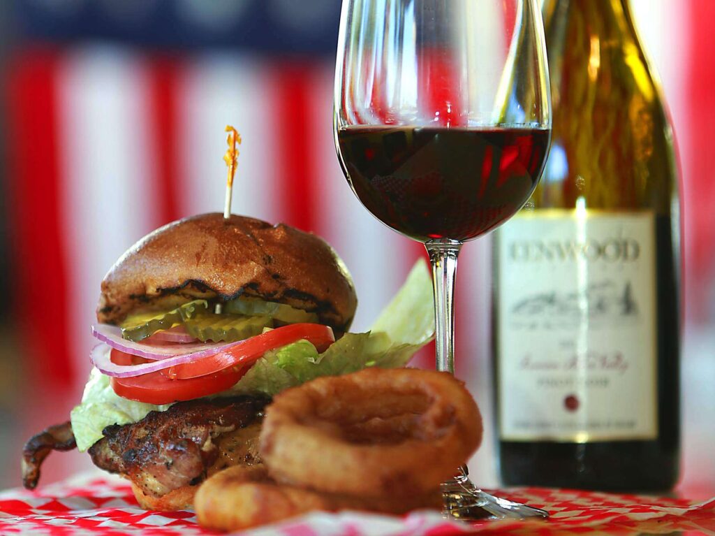 The Superburger burger with the 2012 Kenwood Russian River Valley Pinot Noir. (John Burgess / The Press Democrat, file)