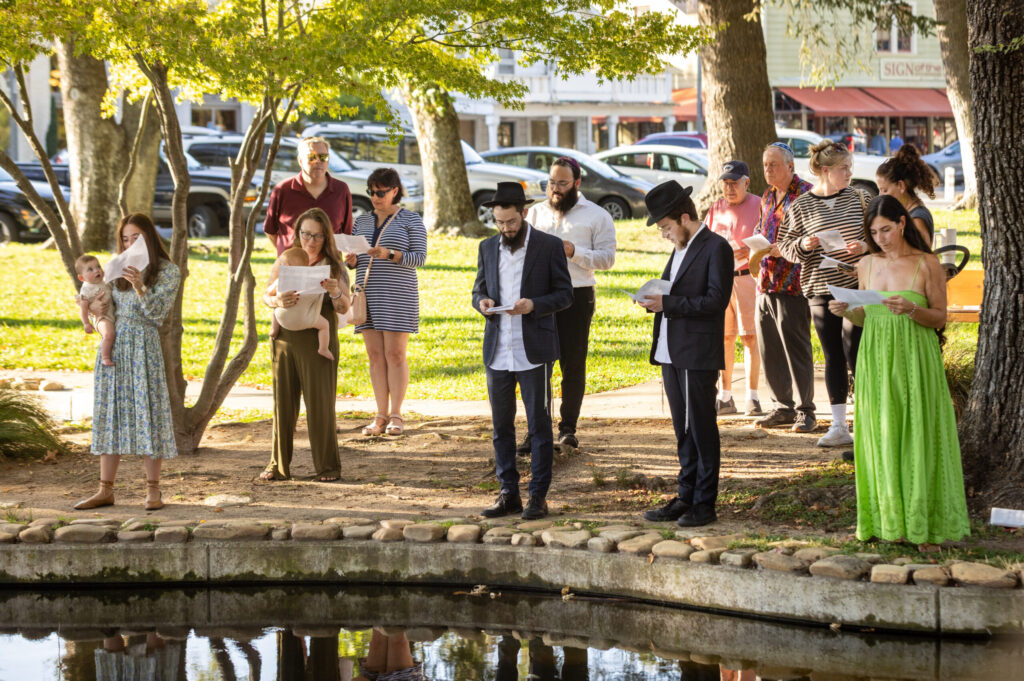 Member of the Chabad Center of Sonoma Valley gather for the Tashlich prayer, a Jewish High Holiday ritual performed on the first day of Rosh Hashanah, where people go to a body of water to symbolically cast away the sins of the past year Tuesday, Sept. 23, 2025 in the Sonoma Plaza. (John Burgess / The Press Democrat)